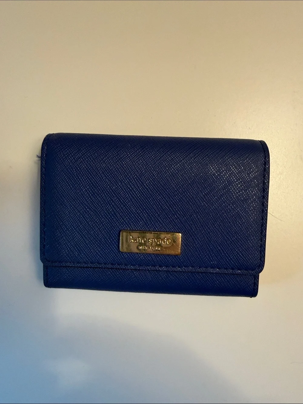 kate spade cobalt blue Saffiano leather compact wallet with gold plaque